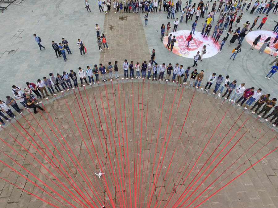 Dozen of couples participate in group wedding ceremony in SW China