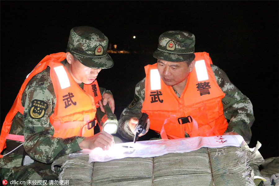 Remember emerging heroes in China's floods