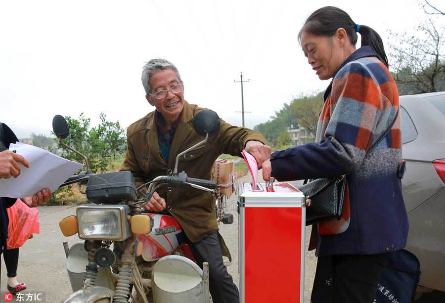 Xi casts vote for new lawmakers
