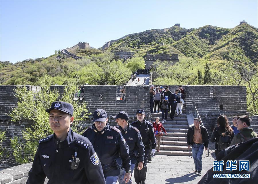 Italian police officers walk beats on Great Wall