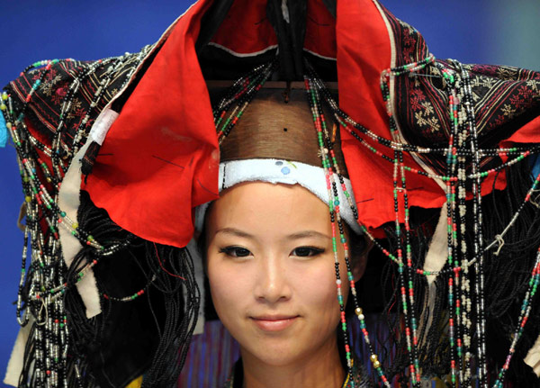 A headdress and neck accessories from the Dong ethnic group are part of a fashion show in Southwest China’s Guizhou province, on Sept 9, 2011. Ethnic style showcased in Guizhou