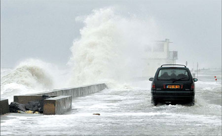 Storm shuts airports, cuts power to thousands