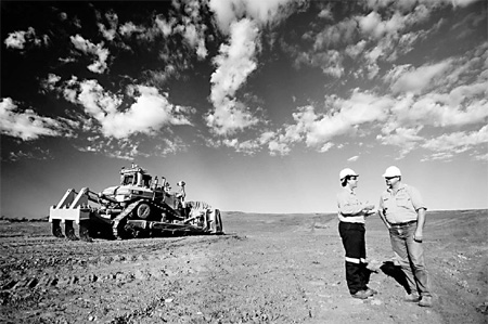 Xstrata takes a hit from slump in metal prices