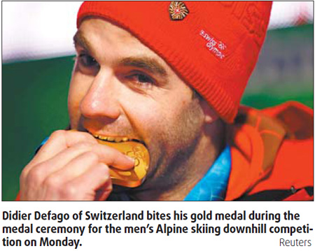 Swiss skier rolls to victory as Winter Games come alive