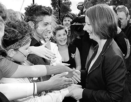 Australia PM Julia Gillard: First female leader fights close election