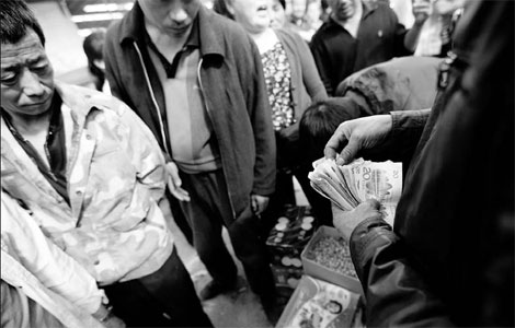 Yuan rises past key level versus dollar