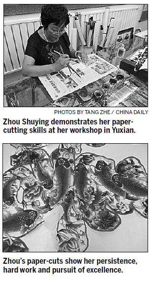 Paper-cut artists strive to rise above technology