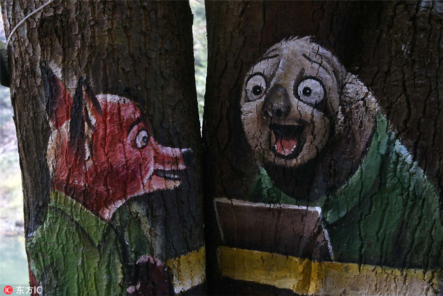 Paintings bring tree trunks to life
