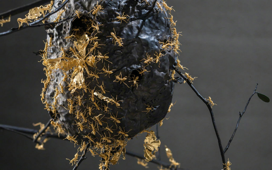 Gold and wood insects fly in Beijing's museum