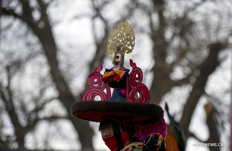 Tibetan Buddhist monks perform to greet Tibetan New Year