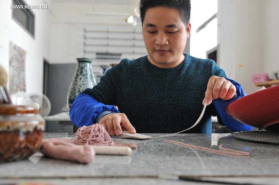 Lacquer thread sculpting listed as one of China's national intangible heritages