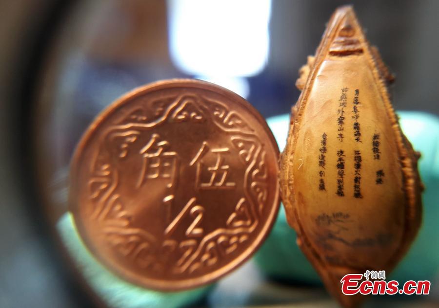 Taiwan artist carves rich scene all on olive nut