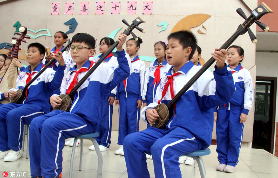 Students perform traditional Pingtan opera in Suzhou