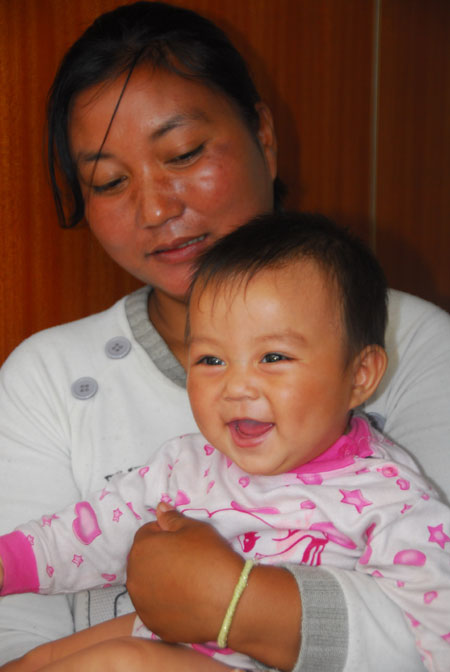 云南16名被解救婦女兒童返回家鄉