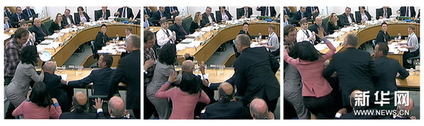 默多克聽(tīng)證會(huì)遇襲 鄧文迪飛身護(hù)夫[組圖]