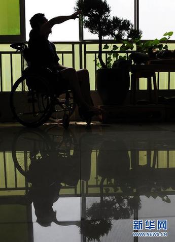 走近用微博掀起“蝴蝶效應”的“輪椅哥”周亞武
