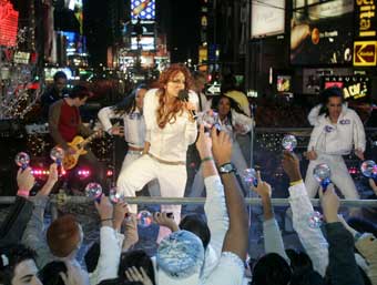 Pop singer Lindsey Lohan performs her song "Rumors" as part of the New Year's Eve celebrations in Times Square, December 31, 2004. A century after the first New Year's Eve celebrations in Times Square, hundreds of thousands of revelers turned out in unseasonably warm weather to watch the ball drop atop One Times Square to signal the start of the New Year.