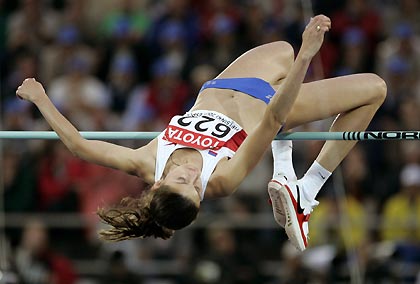 Anna Chicherova of Russia clears the bar during the women's high jump final at the world athletics championships in Helsinki August 8, 2005.