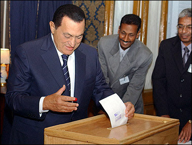 This handout picture released by Egypt's ruling National Democratic Party shows President Hosni Mubarak casting his vote in the country's first ever contested presidential election at a polling station in Cairo.