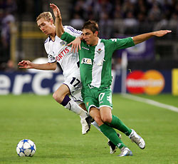 Real Betis' Joaquin Sanchez fights for the ball with Anderlecht's Christian Wilhelmsson (L) during their Champions League Group G soccer match at the Constant Vanden Stock stadium in Brussels September 28, 2005.