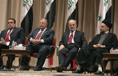 Abdul-Aziz al-Hakim, head of the Supreme Council for the Islamic Revolution in Iraq (SCIRI), Iraqs Prime Minsiter Ibrahim al-Jaafari, President Jalal Talabani, and Speaker of Iraqs Transitional National Assembly (TNA) Hajim al-Hassani, sit during a special session for TNA Wednesday Oct. 12, 2005, in the heavily fortified Green Zone area in Baghdad, Iraq.