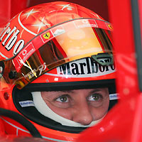 errari's Formula One driver Michael Schumacher of Germany sits in his car during the fourth practice session for the Chinese Grand Prix in Shanghai October 15, 2005.