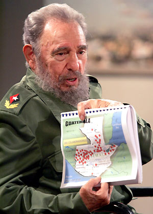 Diego Maradona (L) and Cuban President Fidel Castro smile after appearing together on a live television broadcast in Havana, October 27, 2005. Maradona was in Havana to interview Castro for his weekly television show in Argentina and promised President Castro he would be at the front of an anti-Bush march in Argentina next week.