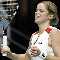 Belgium's Kim Clijsters smiles as she beats Italy's Francesca Schiavone during their WTA Gaz De France Stars tennis tournament final in Hasselt, Belgium, Sunday Oct. 30, 2005.