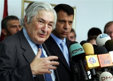 International envoy James Wolfensohn, left, and Palestinian Minister of Civil Affairs Mohammed Dahlan talk to the press after visiting the Karni crossing between the Gaza Strip and Israel Sunday Nov. 13, 2005.