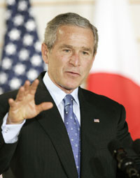 President George W. Bush gestures during a joint news conference with Japan's Prime Minister Junichiro Koizumi at the Kyoto State Guest House November 16, 2005. Bush congratulated Koizumi on his economic reforms, which he said were working. Bush is on a week-long, four-nation Asian tour that will also take him to South Korea, China and Mongolia.