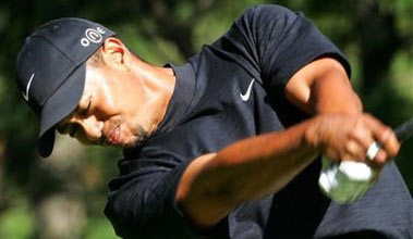 Tiger Woods shots on the 3rd hole during the opening round of the Phoenix Tournament at the Phoenix Country Club in Miyazaki, southern Japan Thursday, Nov. 17, 2005.