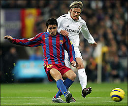 Barcelona's Deco(L) is challenged by Real Madrid's David Beckham during their Spanish Liga football match in Santiago Bernabeu stadium in Madrid.