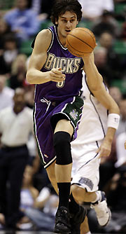 ilwaukee Bucks center Andrew Bogut chases down a loose ball ahead of the Utah Jazz during the first half of NBA action in Salt Lake City November 21, 2005.