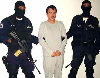 An attorney general's office handout photo shows Ricardo Garcia Urquiza in police custody at an undisclosed location in Mexico.