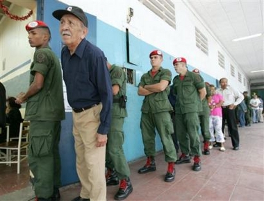 Venezuelan soldiers
and civilians line up to vote at a poll station in Caracas, Venezuela, Sunday, Dec. 4, 2005.