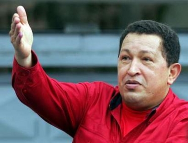 Venezuelan President Hugo Chavez greets supporters after casting his ballot during legislative elections in Caracas, December 4, 2005.