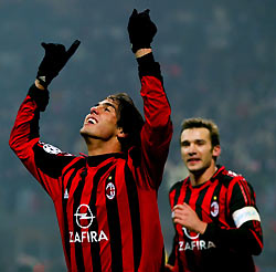 Kaka (L) celebrates scoring against Schalke 04 with Andriy Shevchenko during their Champions League Group E soccer match at the San Siro Stadium in Milan December 6, 2005.
