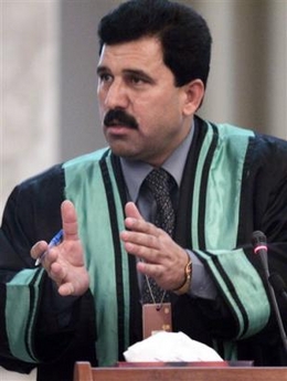 Khalil Dulaimi, one of the lawyers for Saddam Hussein, speaks to the judge at Saddam's trial in Baghdad, Iraq, Thursday, Dec. 22, 2005.