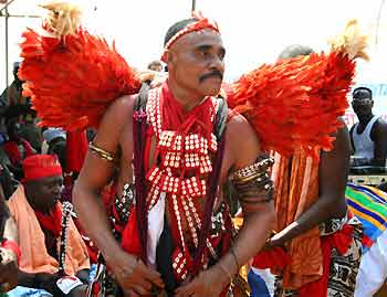 A Voodoo religion follower attends an international celebration of Voodoo spirituality in Ouidah, Benin January 10, 2006. The festivities attracted thousands of people from North America, Europe and West Africa - the original home of Voodoo.