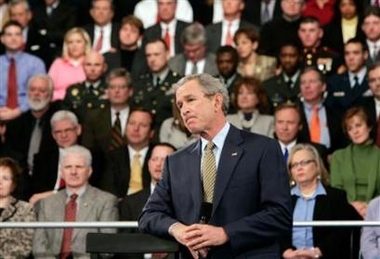 President Bush listens to a question while delivering comments about the U.S. military involvement in Iraq at the Kentucky International Convention Center in Louisville, Kentucky, January 11, 2006.