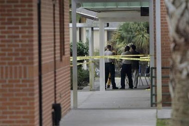 The parents of a 15-year-old boy accused of terrorizing classmates with a pistol warned authorities the weapon likely was fake before police shot him in a middle school bathroom, a family attorney said Saturday.