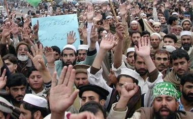 Angry protesters chant anti-U.S. slogans during a protest in Peshawar, Pakistan on Sunday, Jan. 15, 2006.