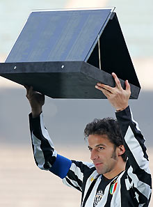 Juventus Alessandro Del Piero holds a trophy to celebrate his 183 goals with Juventus before the start of their Italian Serie A soccer match against Reggina at the Delle Alpi stadium in Turin January 15, 2006.