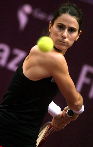 Nathalie Dechy of France eyes the ball during her match against compatriot Marion Bartoli in the first round of the indoor Paris tennis open at Pierre de Coubertin stadium, February 8, 2006.