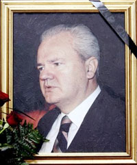A picture of former Yugoslav President Slobodan Milosevic is adorned with a black cloth of mourning at the Socialist Party headquarters, on Saturday, March 11, 2006. Slobodan Milosevic, the former Serbian president who orchestrated the Balkan wars of the 1990s and was on trial for war crimes, was found dead in his prison cell at the U.N. detention center near The Hague. (AP