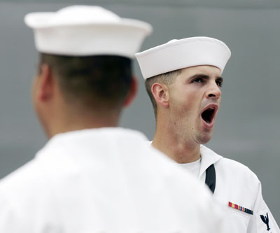 crewman from the USS Park Royal guided missile cruiser yawns as he waits for the U.S. Secretary of State Condoleezza Rice's arrival at a naval base in Sydney March 16, 2006. Rice is on a three-day visit to Australia.