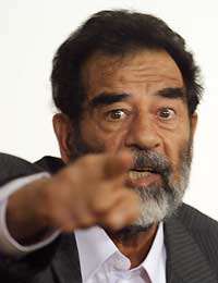 Saddam scoffs at charges of war crimes
