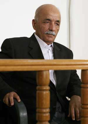 Saddam and his aids in court