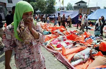 Bodies piled on coasts as tsunami kills 24,000