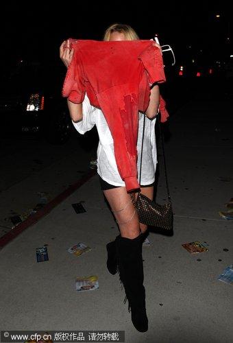 Lindsay Lohan covered head at EDC Rave Dance party